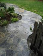 flagstone pathway with planting on either side